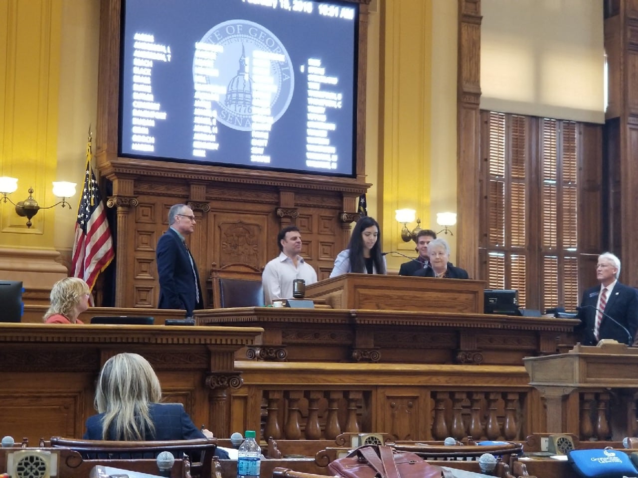 Hannah Testa, delivering her speech about the resolution (SR695.